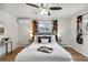 Bright bedroom with a ceiling fan and stylish decor at 9962 W 77Th Ave, Arvada, CO 80005