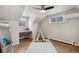 Bedroom with hardwood floors, ceiling fan, and a playful teepee at 9962 W 77Th Ave, Arvada, CO 80005