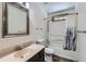 Well-lit bathroom featuring a tub shower and modern fixtures at 7219 S Brook Forest Rd, Evergreen, CO 80439