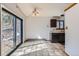 Kitchen and dining area with sliding glass door and tiled flooring at 7219 S Brook Forest Rd, Evergreen, CO 80439