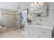 Main bathroom featuring a tiled shower, soaking tub, and vanity with granite counters at 9284 S Cedar Hill Way, Lone Tree, CO 80124