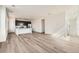 Open concept living and kitchen area featuring hardwood floors, recessed lighting, and ample space at 2150 S Haleyville Way, Aurora, CO 80018