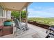Relaxing back porch featuring comfortable seating and picturesque green space at 6618 Lynch Ln, Castle Rock, CO 80108