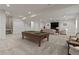 Spacious basement area with a pool table, comfortable seating, and cozy decor for relaxed recreation at 6618 Lynch Ln, Castle Rock, CO 80108