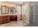Elegant bathroom featuring a double vanity, a glass-enclosed shower, and modern fixtures, offering a spa-like experience at 6618 Lynch Ln, Castle Rock, CO 80108