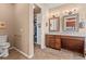 Well-appointed bathroom with a double vanity, a private toilet area, and ample storage, offering functionality and style at 6618 Lynch Ln, Castle Rock, CO 80108