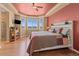 Bright bedroom featuring a bay window, hardwood floors, and a stylish ceiling fan, offering a comfortable retreat at 6618 Lynch Ln, Castle Rock, CO 80108
