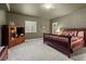 Inviting bedroom with a warm color palette, wooden furniture, and soft carpet for comfortable living at 6618 Lynch Ln, Castle Rock, CO 80108