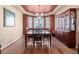 Dining room features wood floors, a built in hutch for storage, and natural light from the large windows at 6618 Lynch Ln, Castle Rock, CO 80108