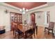 Formal dining room with wood floors, chandelier lighting, and elegant built in hutch for ample storage at 6618 Lynch Ln, Castle Rock, CO 80108