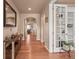 Spacious foyer with hardwood floors, arched doorways, and a view of the living room, creating an inviting entrance at 6618 Lynch Ln, Castle Rock, CO 80108