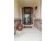 Inviting front porch entrance featuring a decorative door, stone accents, and a welcoming potted plant at 6618 Lynch Ln, Castle Rock, CO 80108