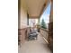 Inviting front porch with stone pillars and comfortable chairs, ideal for relaxation and enjoying the neighborhood views at 6618 Lynch Ln, Castle Rock, CO 80108