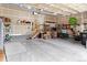 Spacious three car garage with ample storage shelving and overhead lighting at 6618 Lynch Ln, Castle Rock, CO 80108