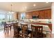 Kitchen features wooden cabinets, granite countertops, and stainless steel appliances at 6618 Lynch Ln, Castle Rock, CO 80108