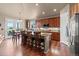 Spacious kitchen with wooden cabinets, a center island, and stainless steel appliances at 6618 Lynch Ln, Castle Rock, CO 80108