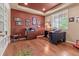 Home office with hardwood floors, abundant natural light, and stylish decor, creating a productive workspace at 6618 Lynch Ln, Castle Rock, CO 80108