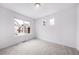Bright bedroom with large windows offering plenty of natural light and neutral carpet at 1175 Highview Dr, Erie, CO 80516