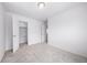 Bedroom features neutral-colored carpet and walk-in closet at 1175 Highview Dr, Erie, CO 80516