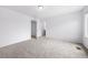 Spacious bedroom with neutral carpet, and a doorway leading to another room at 1175 Highview Dr, Erie, CO 80516