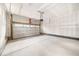Spacious two-car garage featuring sealed concrete floors and ample storage space at 1175 Highview Dr, Erie, CO 80516