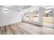 Bright, open-concept living space featuring hardwood floors, and a sliding glass door to the back patio at 1175 Highview Dr, Erie, CO 80516