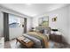Bedroom with a large window, neutral walls, and modern decor at 1175 Highview Dr, Erie, CO 80516