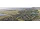 Primary-planned community with residential homes, green spaces, walking paths, and a scenic lake, fostering an active lifestyle at 17136 W 92Nd Loop, Arvada, CO 80007