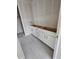 White bathroom vanity with gray tile floors awaits final fixtures in this new construction home at 17136 W 92Nd Loop, Arvada, CO 80007