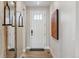 Inviting entryway with modern accents, wood flooring, and a stylish mirror at 17136 W 92Nd Loop, Arvada, CO 80007