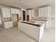 Spacious kitchen is in the middle of construction with unfinished cabinetry at 17136 W 92Nd Loop, Arvada, CO 80007