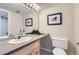 Bathroom with double vanity, updated lighting, and neutral decor at 14006 E Stanford Cir # K04, Aurora, CO 80015