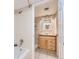 Bathtub and vanity in a bright, renovated bathroom with a tiled floor at 14006 E Stanford Cir # K04, Aurora, CO 80015
