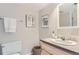Bathroom features a vanity with modern hardware and art at 14006 E Stanford Cir # K04, Aurora, CO 80015