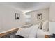 Well lit bedroom featuring a soft rug, and contemporary artwork at 14006 E Stanford Cir # K04, Aurora, CO 80015