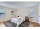 Cozy bedroom with natural light, a soft rug and neutral colored walls at 14006 E Stanford Cir # K04, Aurora, CO 80015
