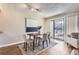 Bright dining space with sliding glass door to outdoor area, enhancing the living experience at 14006 E Stanford Cir # K04, Aurora, CO 80015