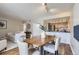 Inviting dining area with modern table, open to living room and kitchen for easy entertaining at 14006 E Stanford Cir # K04, Aurora, CO 80015