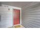 Exterior shot of the unit's front door with a neutral welcome mat at 14006 E Stanford Cir # K04, Aurora, CO 80015