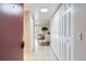 Inviting hallway features tiled floors, ample closet space, and leads into a bright, open living area at 14006 E Stanford Cir # K04, Aurora, CO 80015