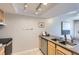 Kitchen area with appliances, stainless steel dishwasher, and tile flooring at 14006 E Stanford Cir # K04, Aurora, CO 80015
