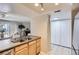 Kitchen view with stainless steel sink and appliances and nearby dining area at 14006 E Stanford Cir # K04, Aurora, CO 80015