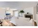 Open concept living space with dining area, fireplace, and comfortable seating for a relaxed lifestyle at 14006 E Stanford Cir # K04, Aurora, CO 80015