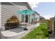 Home's large backyard with patio includes dining and prep areas, a beautiful lawn, and privacy fence at 4635 S Odessa St, Centennial, CO 80015