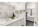 Bathroom with double vanity, modern mirrors, and a shower/tub combo, ensuring comfort and elegance at 4635 S Odessa St, Centennial, CO 80015