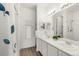 Bright bathroom featuring double sinks, modern lighting, and a shower, creating a comfortable and functional space at 4635 S Odessa St, Centennial, CO 80015