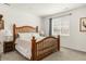 Bedroom with a wooden-frame bed and an abundance of natural light from the window at 4635 S Odessa St, Centennial, CO 80015