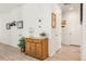Entry hallway featuring light wood floors and an antique wood cabinet for storage and style at 4635 S Odessa St, Centennial, CO 80015
