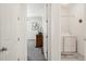 Hallway view leading to a bedroom and laundry room, providing convenience and accessibility at 4635 S Odessa St, Centennial, CO 80015