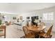 Open concept kitchen with white cabinets and island flows into the dining area at 4635 S Odessa St, Centennial, CO 80015